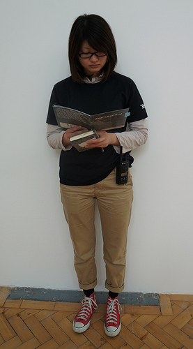 Asako reading a Zoe Leonard catalogue at the Zoe Leonard exhibition (Camden Arts Centre) by Read Me Something You Love