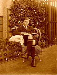 Teenage boy reading a book in the garden, 1910-1920, Queensland, Australia • <a style="font-size:0.8em;" href="http://www.flickr.com/photos/81015582@N06/7430737246/" target="_blank">View on Flickr</a>